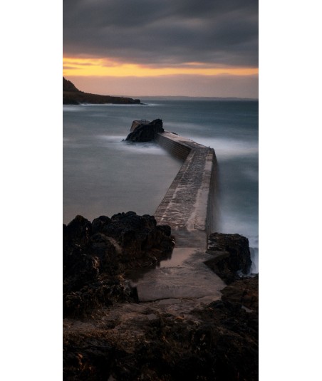 Digue de Doëlan en pose longue au coucher du soleil