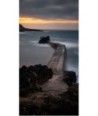 Digue de Doëlan en pose longue au coucher du soleil